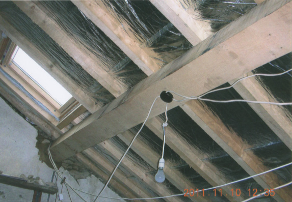 Specialists in re-roofing churches, church porch roof stripped back to the old lath plaster